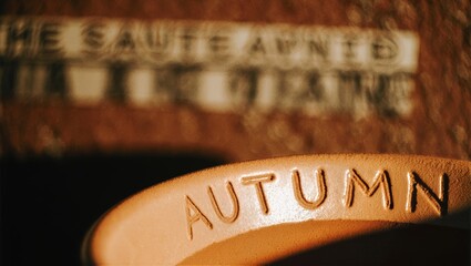 Autumn Embossed on Warm Clay Rim, Minimal Studio Glow, Earthy Ceramic Texture Seasonal Background