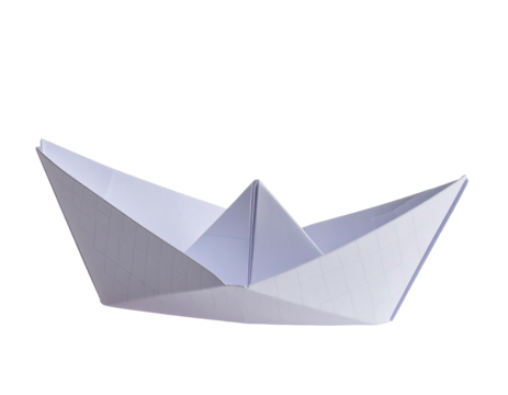 Folded white paper boat, simple origami design, angled view