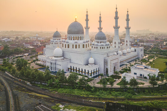 Aerial view of the majestic Sheikh Zayed Grand Mosque bathed in the soft glow of the setting sun, Surakarta, Central Java, Indonesia.