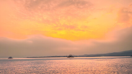 Fiery Sunrise Over Calm Waters in Ujung Kulon