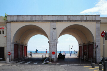 A summer day in Nice, the leisure of a traveler, the blazing sunlight, the beauty of a seaside retreat.