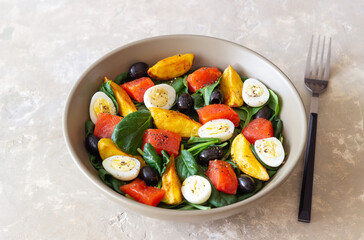 Salad with salmon, spinach, baked potatoes, olives and eggs. Healthy eating. Diet.