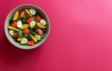 Salad with salmon, spinach, baked potatoes, olives and eggs. Healthy eating. Diet.