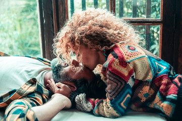 Loving mature couple relaxing at home, sharing affectionate moments and cuddles together, concept...