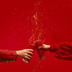 Dynamic red beer cans splash in motion against monochrome red background. Concept of youth lifestyle branding, beverage advertising, and monochrome marketing campaigns. Mockup for text, ad