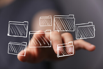 Digital data management concept. Hand selecting files, folders, organization, storage, access.