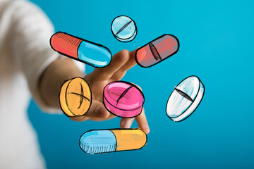 Image of hand interacting with colorful pills and capsules, perfect for healthcare, medicine, pharmacy, and health concepts.