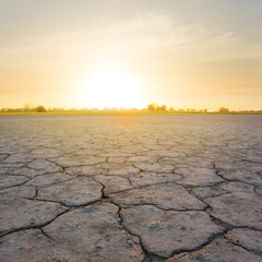 dry cracked saline land at the dramatic sunset