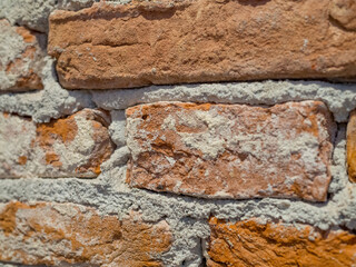 Close-up brick wall texture, rough masonry surface for construction and design background