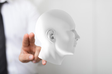 Abstract image of a hand interacting with a 3D human head model.  Ideal for AI, technology, and psychology.