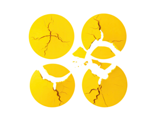 Four cracked, circular, yellow shapes arranged in a plus or cross pattern on a black background