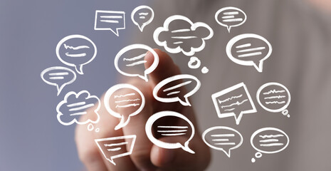 Conceptual image of communication, feedback, and ideas. Hand interacts with speech bubbles.