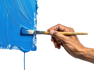 Close-up of hand holding paintbrush applying vibrant blue paint to canvas