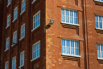 facade of an old building, red brick building with white windows