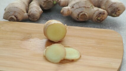 Fresh ginger on wooden background. Dry ginger. Sliced ginger with honey and lemon. Ginger root. Traditional alternative medicine, healing tea for immunity. Seasoning and spices concept. Copy space.