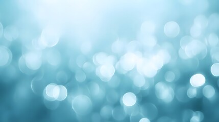Obraz premium A light teal background is dotted with soft, diffused, circular light spots, creating a gentle, ethereal atmosphere.