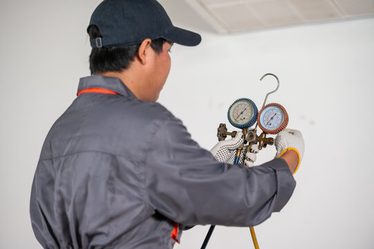 Precision in Maintenance: A skilled technician diligently assesses and maintains HVAC equipment, exemplifying commitment to precision, competence, and the art of climate control.