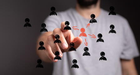 Image depicts a hand selecting a central figure within a network of people, ideal for teamwork,...
