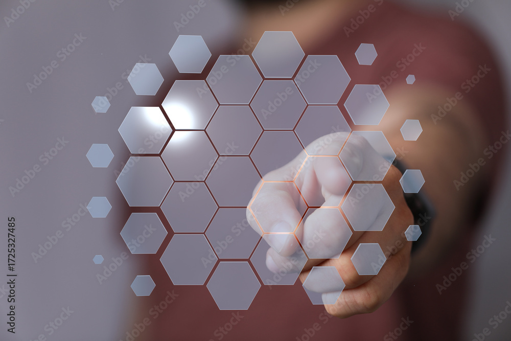 Poster abstract image of a hand interacting with a futuristic hexagon pattern, representing technology, inn