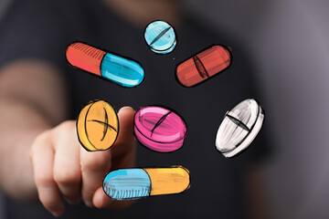 Image depicts a hand interacting with colorful pills, representing healthcare, medicine, or pharmaceutical concepts.