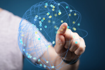 Abstract image of hand interacting with a digital network.  Perfect for technology, connection, and...