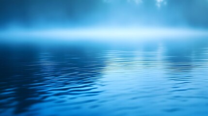 A serene, tranquil scene of still water reflecting a hazy, misty sky, showcasing a soft, cool blue color palette.