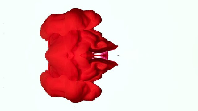 Mesmerizing interweaving of red acrylic ink. A devilish chaotic backdrop. Ecstasy and hypnosis. Vertical video. The oppressive atmosphere of bloodletting. Exorcism of the demon