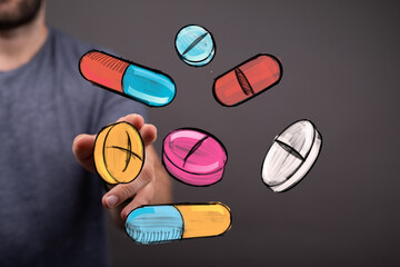 Colorful hand-drawn pills and capsules levitating near a hand.  Perfect for healthcare, medicine, pharmacy concepts.