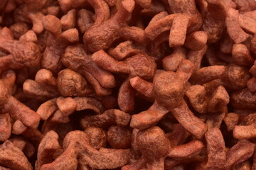 Close up of fried red star-shaped meatballs, Thai street food snack