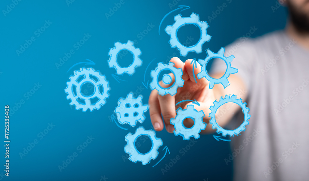 Poster abstract image of a hand interacting with digital gears, symbolizing teamwork, collaboration, and pr