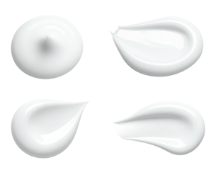 Four isolated, smooth, white cream or lotion smudges, in different shapes and sizes