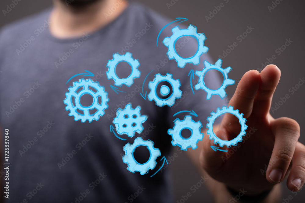 Poster abstract image of a person interacting with digital gears, symbolizing teamwork, process, and effici