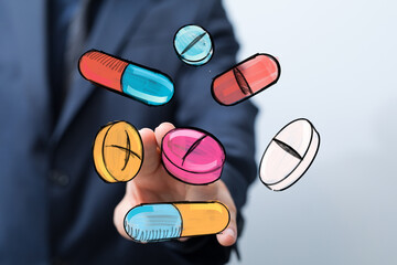 Stock photo of hand interacting with colorful pills and capsules.  Perfect for healthcare, medicine, pharmacy concepts.