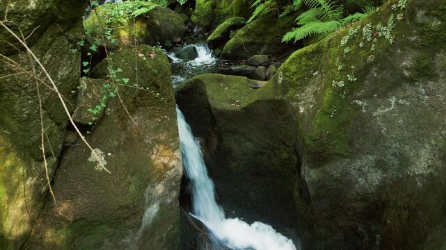 Rapids On Mossy Rocks In The Woods Of Merendero de Ois Park In Xora, A Coru&ntilde;a, Spain. Tracking Shot