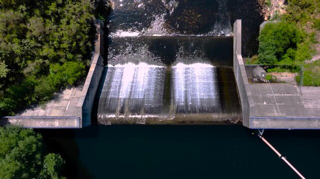 Topdown View Of Concrete Dam In River Lerez Through Campo Lameiro In Galicia, Spain. Aerial Descending Shot