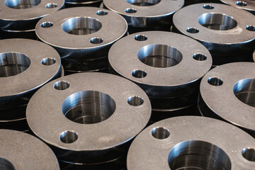 Stack of Metal Flanges in Industrial Workshop, Precision Steel Components for Mechanical Engineering and Manufacturing Production