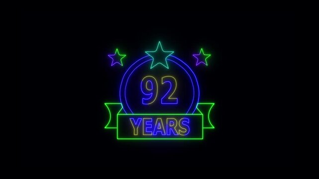 92 Years Anniversary Celebration Neon Sign with Stars and Glowing Banner Highlighting Milestone Achievement and Success.