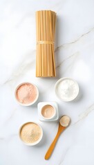 Natural spa treatment composition on marble surface with bamboo sticks and various creams