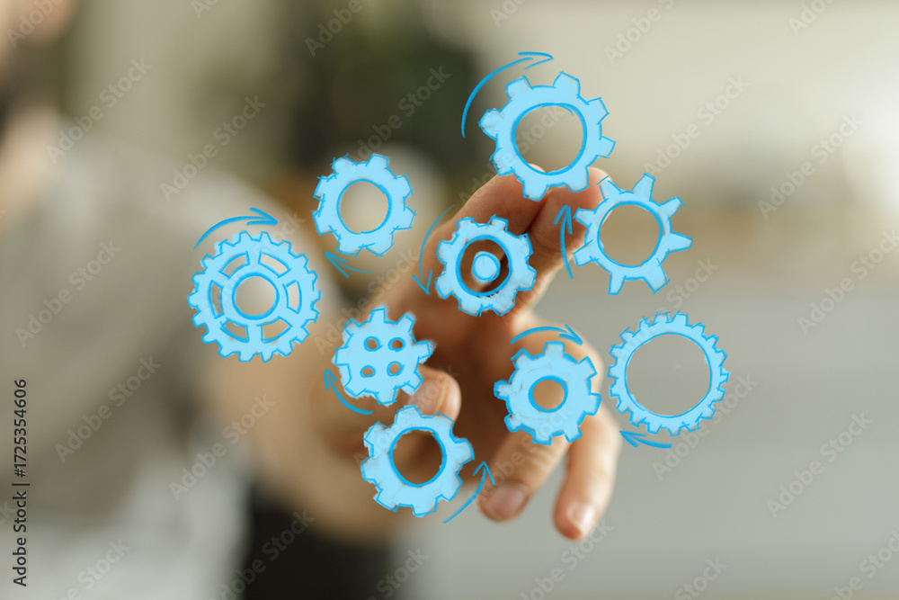 Poster abstract image of hand interacting with gears, symbolizing workflow, teamwork, innovation, and proce