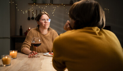 young couple in love drinking wine having romantic dinner at home.