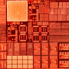 macro photography of semiconductor chip circuit with colorful reflection