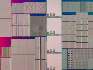 macro photography of semiconductor chip circuit with colorful reflection