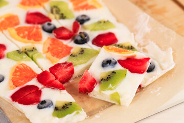 Frozen Yogurt Bark with Kiwi, Blueberry, Orange, and Strawberry.