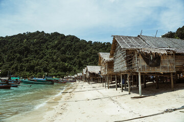 Traditional houses on stilts of Moken Sea Gypsies, built on the beach of Morgan Village, Surin Islands, Thailand