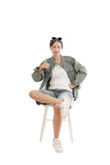 Confidently Casual: A stylish person, radiating confidence with a thumb's up gesture, comfortably seated. Capturing the essence of ease and self-assuredness.