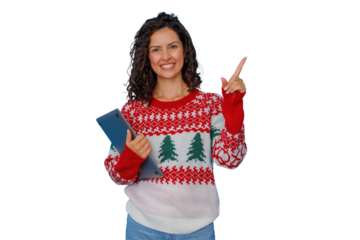 Smiling woman in holiday sweater holding laptop and pointing up, presenting christmas online shopping or festive promotion