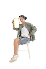 Woman Displaying Device: A stylish woman, exuding confidence, holds up a blank device screen, creating an engaging image perfect for advertisements, applications, or innovative concepts.