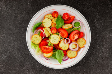 Panzanella salad tomato, croutons, onions vegetables dish natural product tasty snack fresh delicious gourmet food background on the table rustic top view copy space