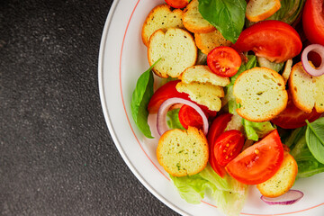 Panzanella salad tomato, croutons, onions vegetables dish natural product tasty snack fresh delicious gourmet food background on the table rustic top view copy space