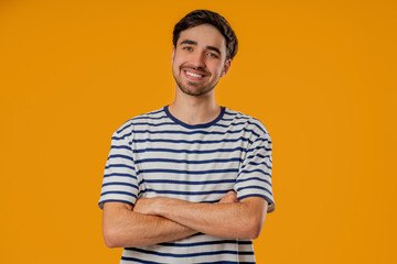 Young Friendly Man Smiling, Confident Happy Guy In Striped t-shirt On yellow